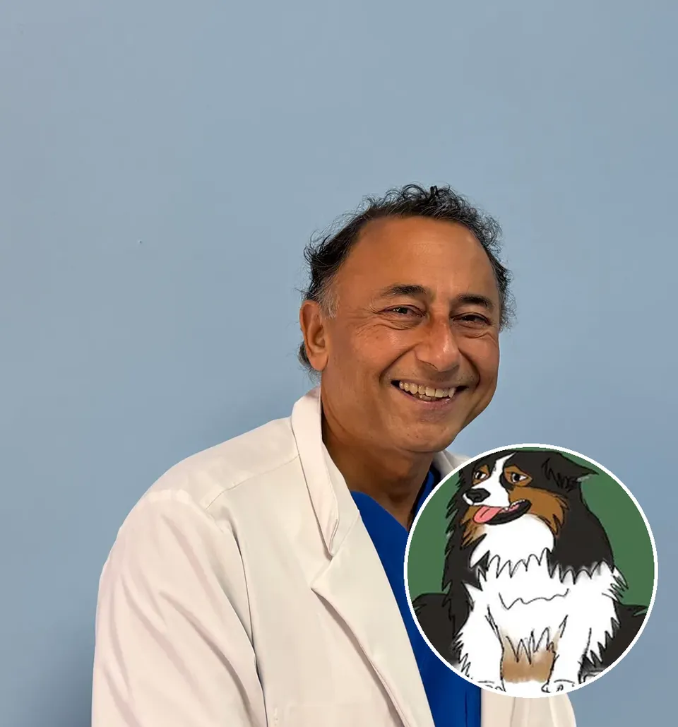 Rajesh Khanna, MD, smiling in his white coat, with Guru, the KVI concierge dog