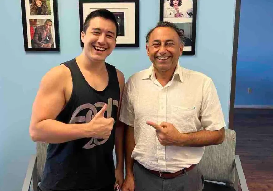 Dr. Khanna with a patient giving a thumbs-up