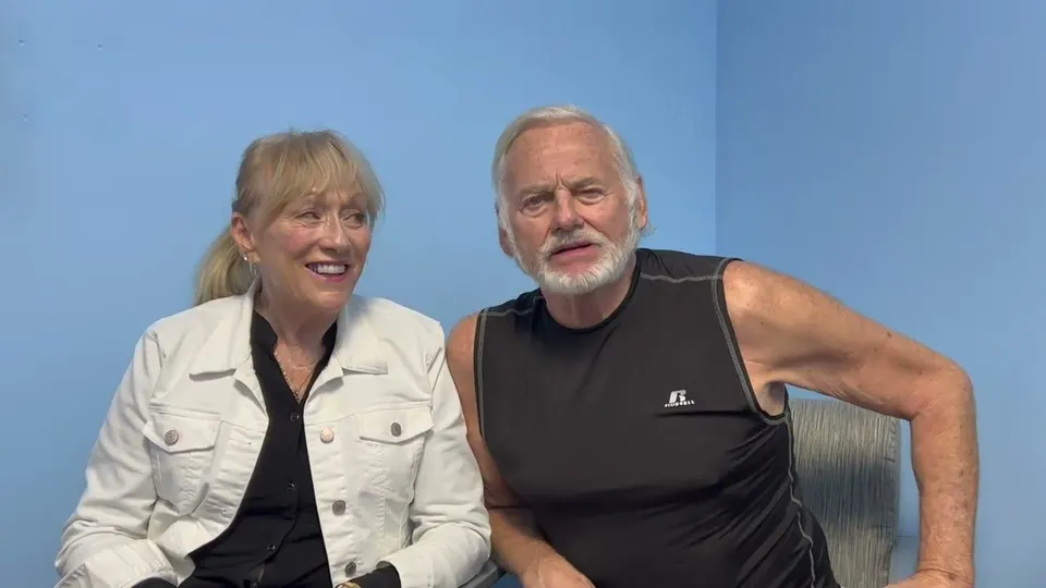 Two PIE patients, a woman and a man, smiling during their video interview